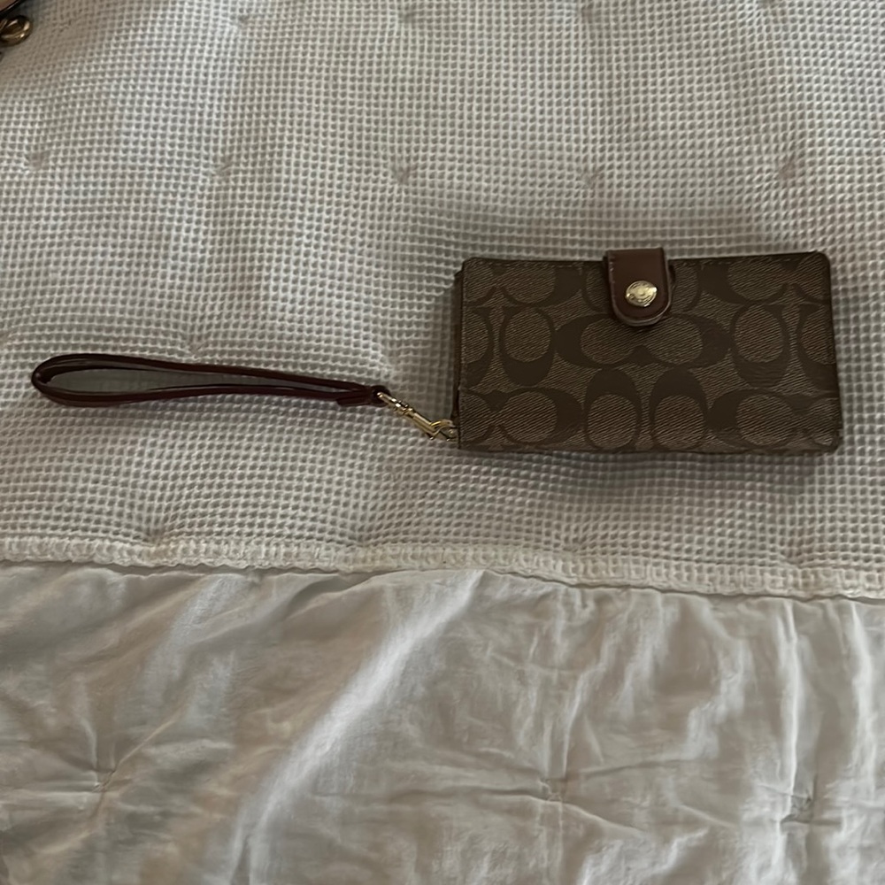 Coach brown and tan phone wristlet. Slightly used